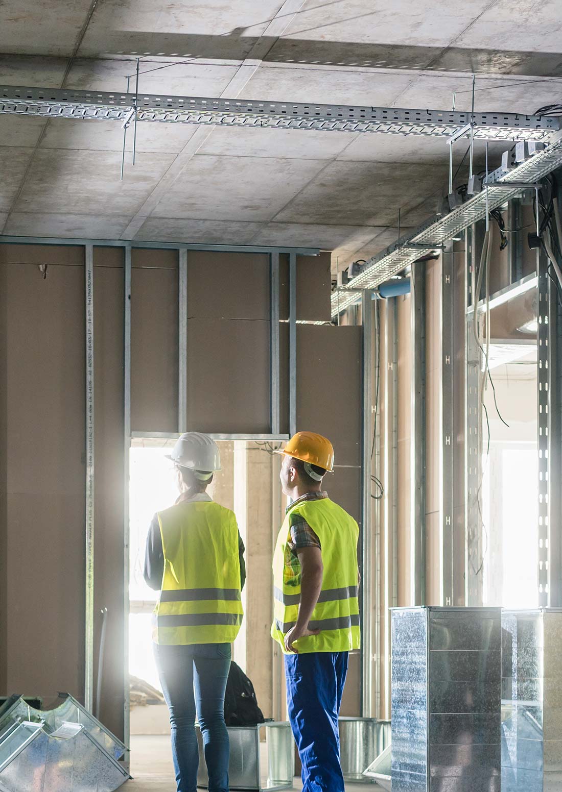 engineers inspecting new construction building